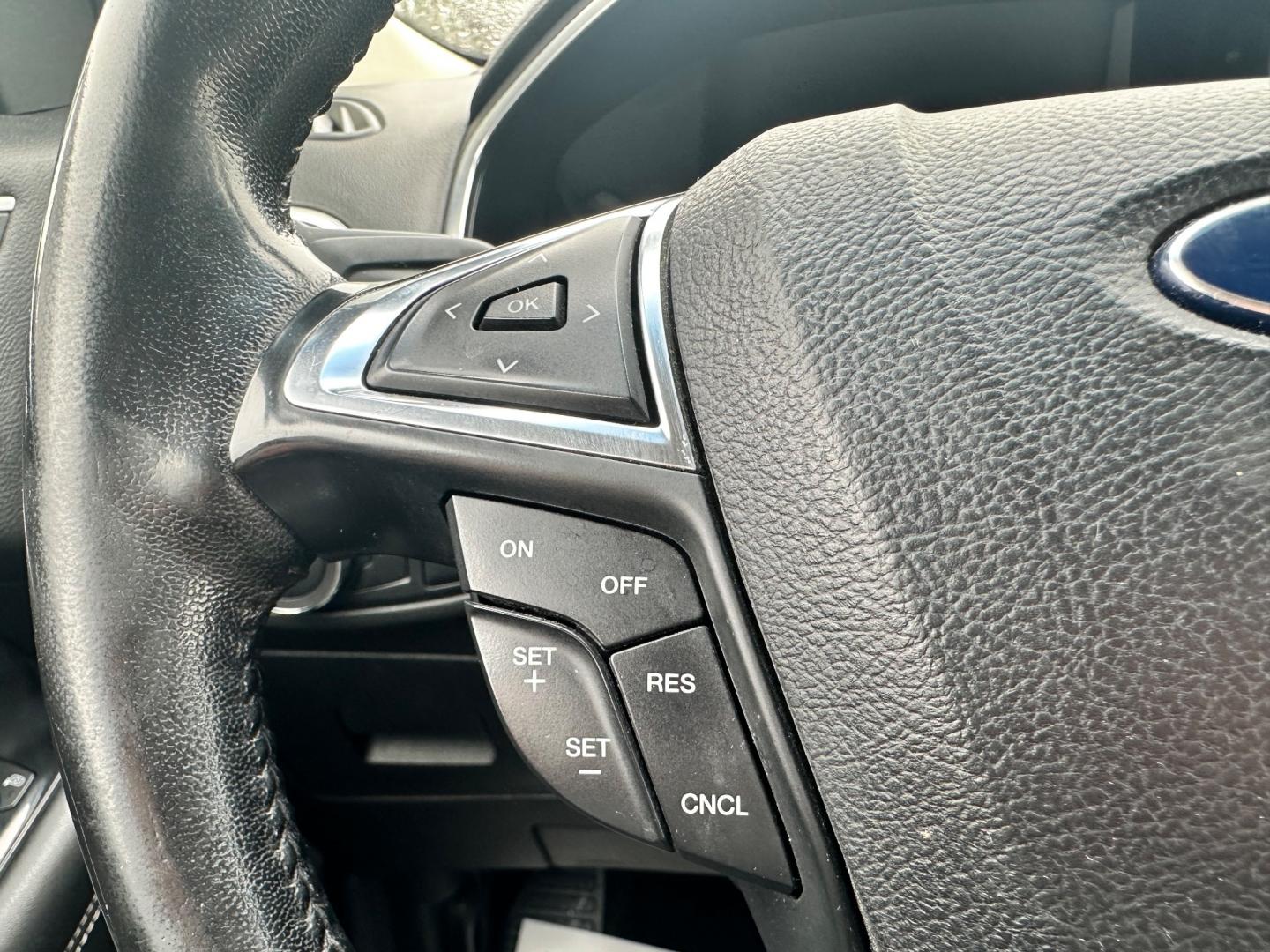 2017 Silver /Black Ford Edge Titanium (2FMPK4K92HB) with an 2.0L I4 DOHC 16V Turbo engine, 6-Speed Automatic transmission, located at 547 E. Main St., Orwell, OH, 44076, (440) 437-5893, 41.535435, -80.847855 - This 2017 Ford Edge Titanium AWD is a well-equipped midsize SUV. It comes with a powerful yet efficient 2.0L EcoBoost engine paired with a smooth 6-speed automatic transmission. Notable features include LED daytime running lights, dusk-sensing headlights, leather interior, auto-dimming rearview mirr - Photo#23